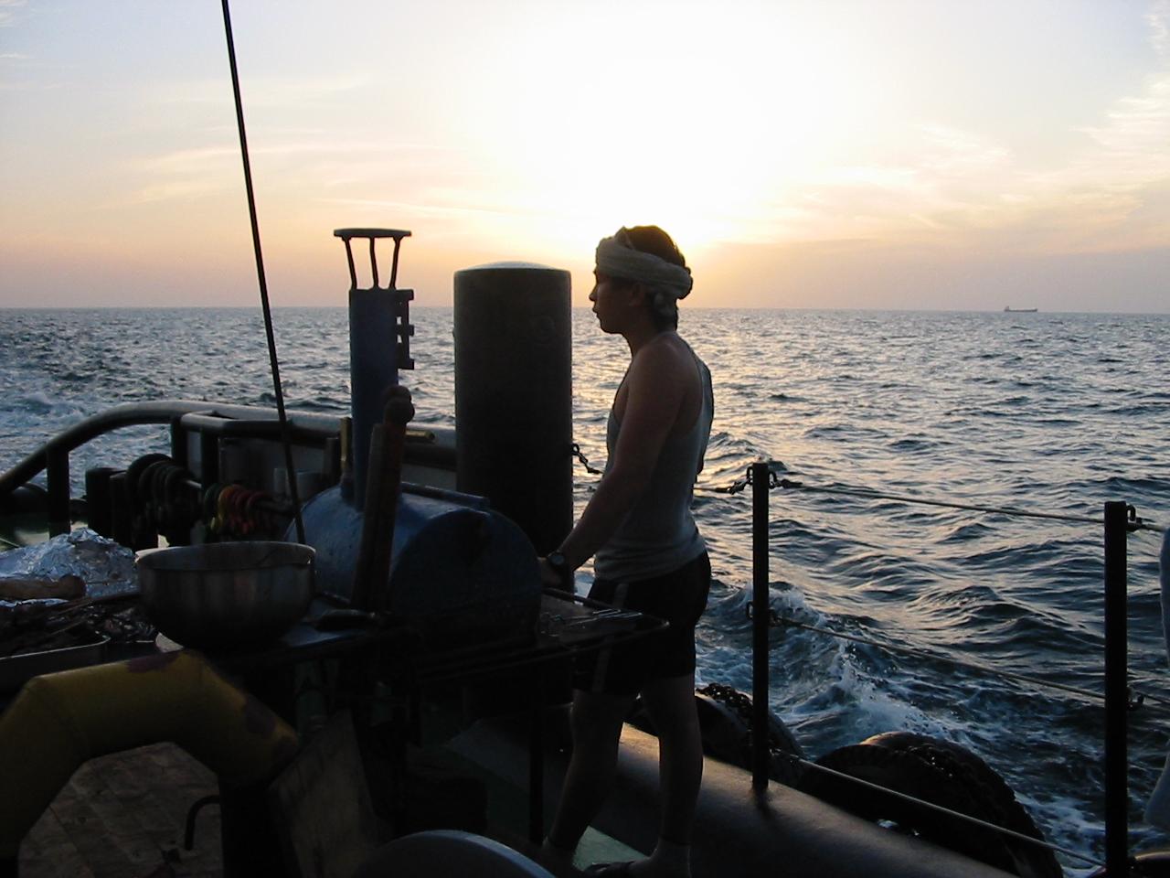 Seafarer looking out at sea